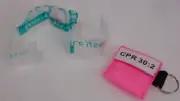 1 Pink Face Shield CPR Mask in Pocket Keychain imprinted 30:2 Compression Ratio