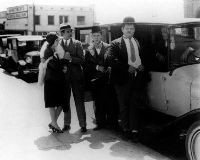 Laurel and Hardy Stan and Ollie exit car on street corner 11x17 inch Poster