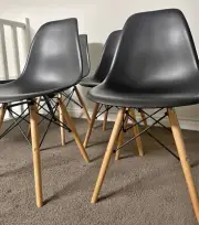 4 dininng chairs BRAND NEW IN BOX -Eames replica black Flat Packed ! Fawkner !