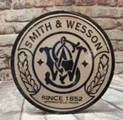 Smith & Wesson - Round Embossed Metal Sign for Man Cave, Cabin or Hunting Lodge