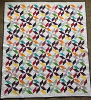Sunburst Lap Quilt: 64 inches by 73 inches