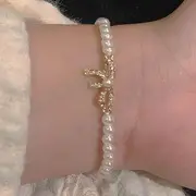 Rhinestone Bow Faux Pearl Bracelet Gold & White - One Size