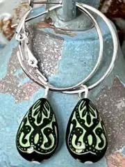 Etched Black and Green Teardrop Dangle with Silver Hoop Earrings. Denim.