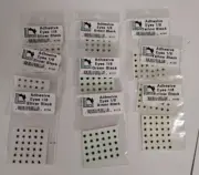 Hareline Adhesive Eyes 1/8 - 3 each of Yellow/Black - Green/Black - Silver/Black