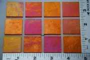 1125.31 - 12 PIECES IRIDIZED TRANSPARENT ORANGE 1"x 1" BULLSEYE GLASS 90 COE
