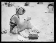 Beach belle sitting on Manly Beach smoking a cigarette, NSW, 1930 Old Photo