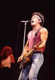 Bruce Springsteen plays guitar as he performs, with the E Street Ba Old Photo 24