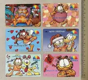 1990's Konica Garfield Season Of Festive Singapore phone card set of 8 mint!