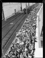 Large crowd walking across the pedestrian footpath of the Sydney H- Old Photo