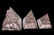 3 basalt pyramids with hieroglyphic inscriptions of the pharaohs of Egypt statue