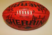 GOLD COAST INAUGURAL TEAM SIGNED SHERRIN FOOTBALL UNFRAMED + PHOTO PROOF & C.O.A