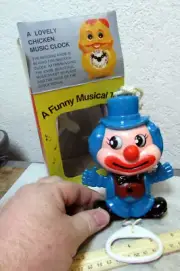 vintage Funny Musical Clown toy wall hanger, pull string & plays a tune & moves
