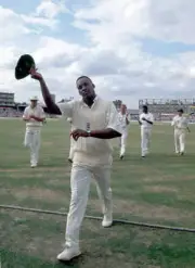 England bowler Devon Malcolm leaving the field of play after - Old Cricket Photo