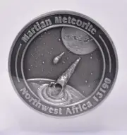 MARTIAN METEORITE WITH COLLECTORS COIN, NORTH WEST AFRICA 13190 MT113