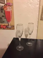 2 Mikasa Gold Mikasa Capella champagne flutes in New/Mint condition.