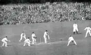 Australias Herbie Collins plays a defensive stroke watched by En- Old Photo
