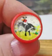 plastic 1960s dime store vending machine toy Flicker Ring, Cowboy on bronco, red