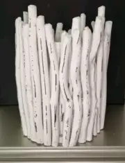 Candlestick. Vase made of tree branches.