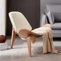 在飛比找樂天市場購物網優惠-輕奢實木椅子ins網紅椅設計師創意簡約單人沙發椅 微笑飛機貝