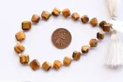 13 inch strand of natural Tiger'S Eye Octagon Faceted 10x10x3.5-7x7x3.5mm beads.