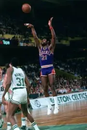 Truck Robinson Phoenix Suns shoots a jump shot over Cedric Maxwell- Old Photo