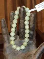 Chinese Jade 2 1/2 inch 8 mm round beads on an elastic bracelet