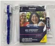 Fixodent Denture Adhesive Travel Size with oral-b denture brush. Pack of 12