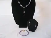 Amethyst gem stone, pendant, bracelet, and earrings. A beaded jewelry set.