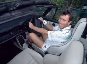 Jeremy Bates of Great Britain poses in his Porsche during the Wimb- Old Photo