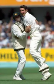 Australian bowler Jason Gillespie celebrates with Greg Blewet- Old Cricket Photo