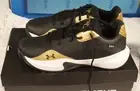 NIB UNDER ARMOUR LOCKDOWN 7 BLACK METALLIC GOLD MENS SZ 13 WOMENS SZ 14.5 SHOES
