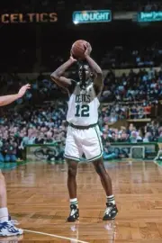 Dominique Wilkins Boston Celtics looks to pass the ball played in - Old Photo
