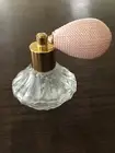 A Cute Small perfume bottle atomizer with light pink bulb In Clear glass