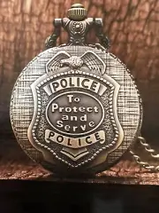 POLICE POCKET WATCH--- TO PROTECT AND SERVE. BRONZE/BLACK. QUARTZ MOVEMENT.