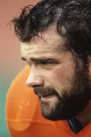 Offensive lineman Keith Bishop Denver Broncos looks on from the si- Old Photo