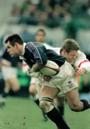 Kenny Logan of Scotland is tackled by Jonny Wilkinson of Engla- Old Rugby Photo