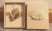 Kirks Folly swan sleigh cherub enamel pin yellow goldtone