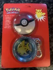 Vintage Pikachu ￼ 2 piece round tin on a key chain 1999 New