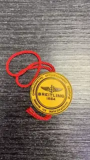 Authentic BREITLING Swiss 1884 Yellow Watch Hang Tag 1