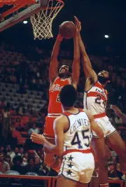 Chet Walker Chicago Bulls grabs a rebound over Manny Leaks Capita- 1974 Photo