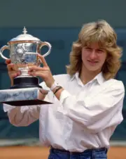Steffi Graf of Germany poses with the trophy after defeating Mart - Old Photo 1