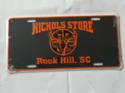 NICHOLS STORE ROCK HILL, SC FULL SIZE METAL BOOSTER LICENSE PLATE SEALED