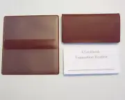 1 BURGUNDY VINYL CHECK BOOK COVER & 10 NEW CHECKBOOK TRANSACTION REGISTERS