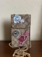 COACH KEITH HARING NORTH/SOUTH PHONE CROSSBODY SIGNATURE CANVAS PATCHES F39955