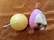 2 Easter Egg candles w/Gold Wrap Pink & Yellow