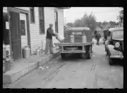 Unloading milk cans at cooperative creamery which has received a l - Old Photo 1