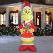 Grinch Holding Candy Canes 9-ft. Christmas Light Up LED Airblown Inflatable