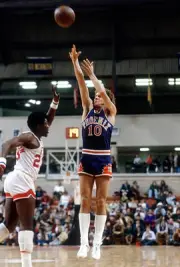 Don Buse Phoenix Suns shoots over John Williamson New Jersey Nets - Old Photo