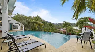 Ocean-View Flamingo Palace with Stone Courtyard and Giant Infinity Pool