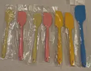 Set Of Seven Multicolored Silicone Spatulas And Scrapers